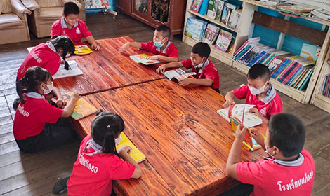 Elementary school students using the furniture and educational toys